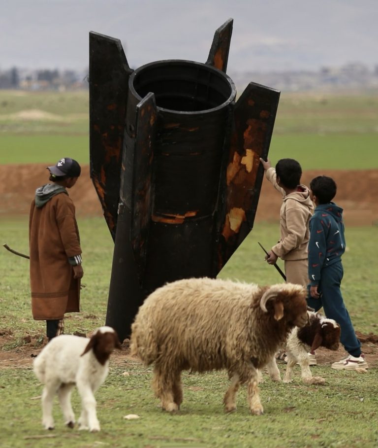 People Gathered Around a Missile that Landed near Qamishli International Airport
